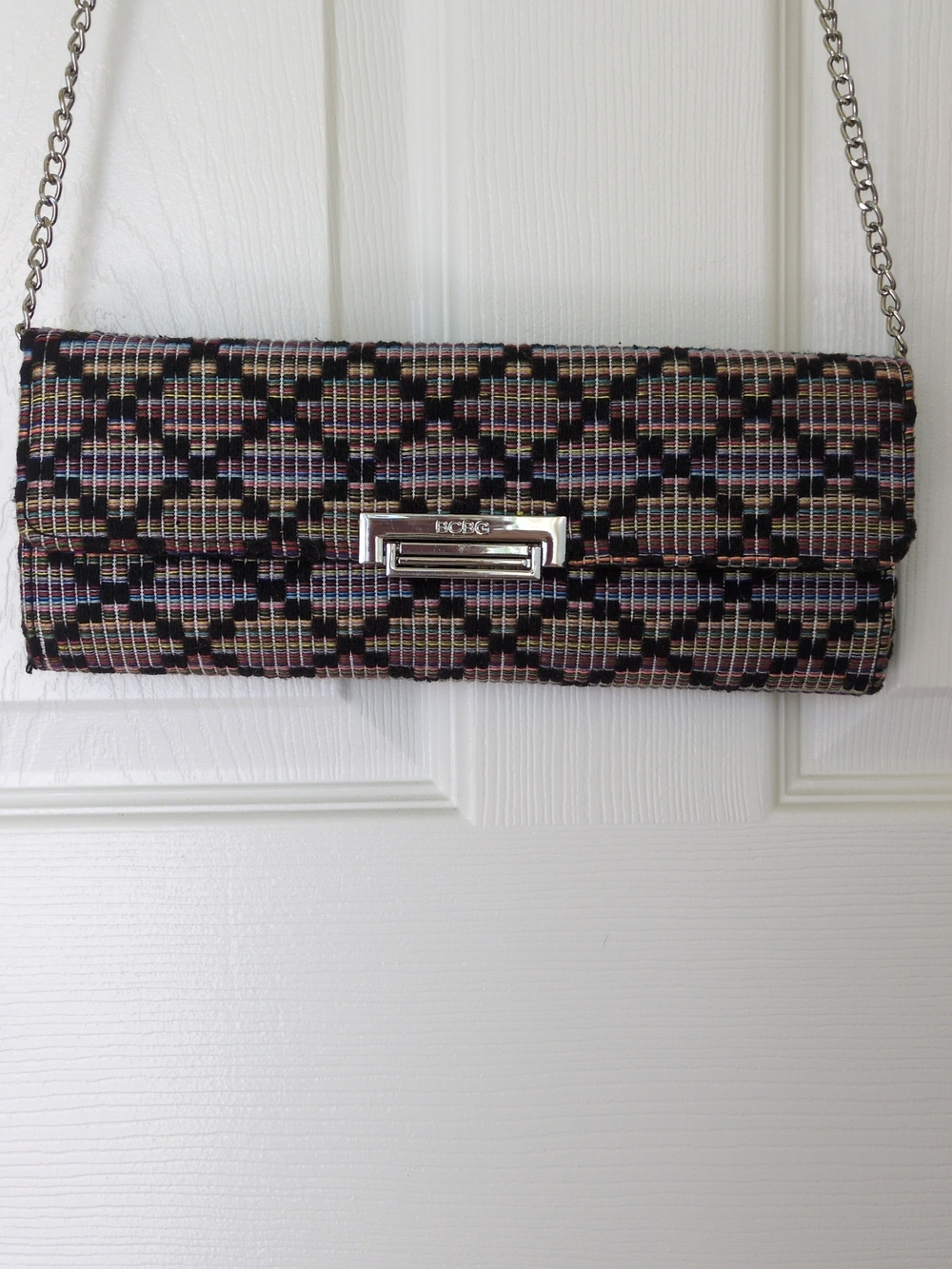 BCBG Woven Clutch with Silver Chain and Black Multicolor Weave